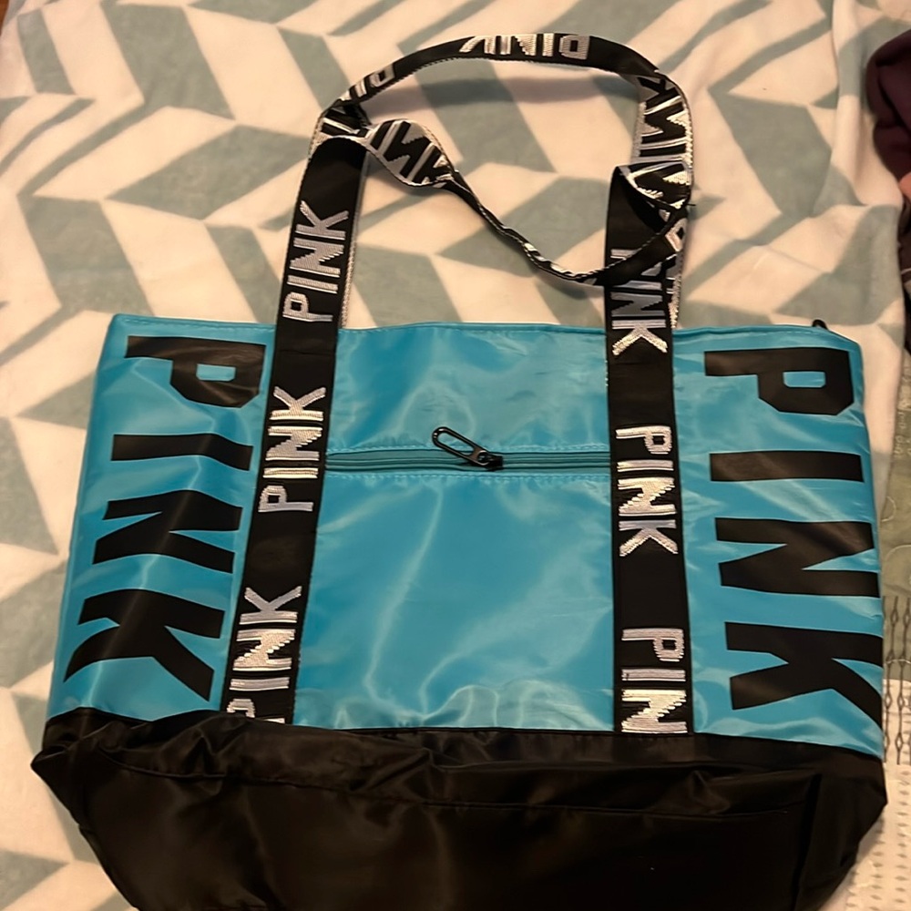 Never used bag.  Teal and black.